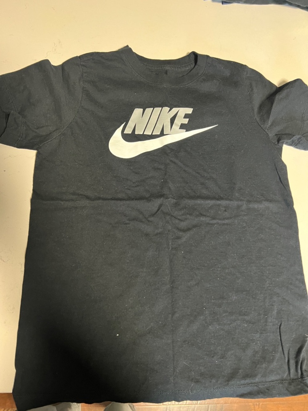 Nike Black T-Shirt with White Swoosh and Wordmark